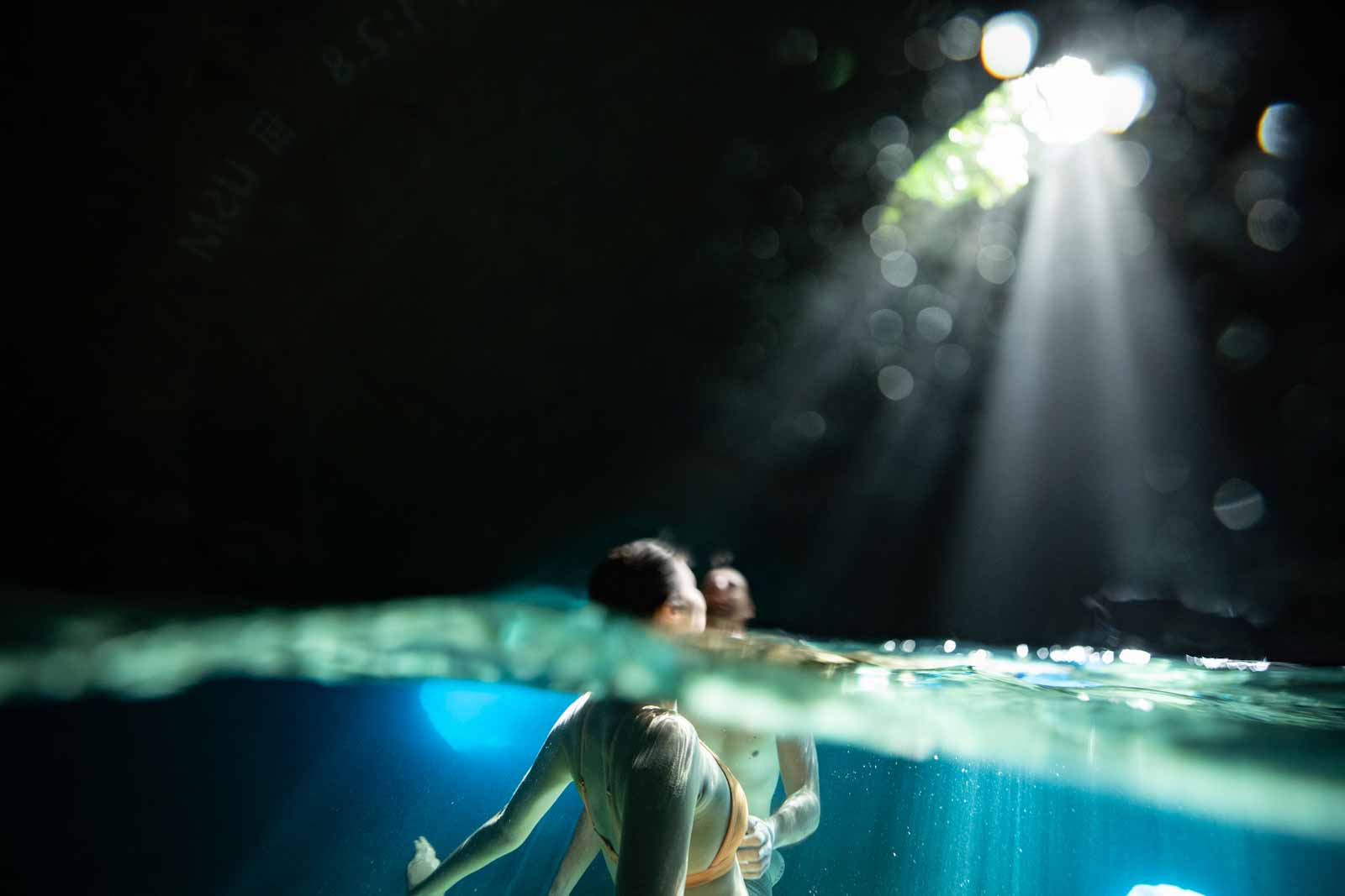 two people swimming in a cave in Vanuatu 