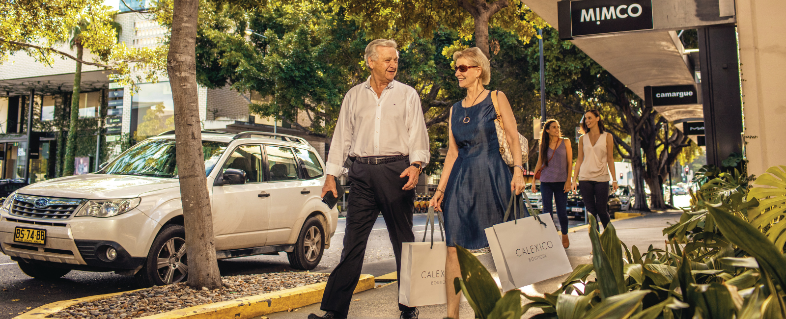 Two people with shopping bags in James Street