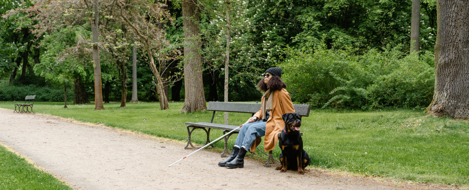 Guide dog and owner in park